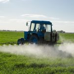 ractor spray fertilize field with insecticide herbicide